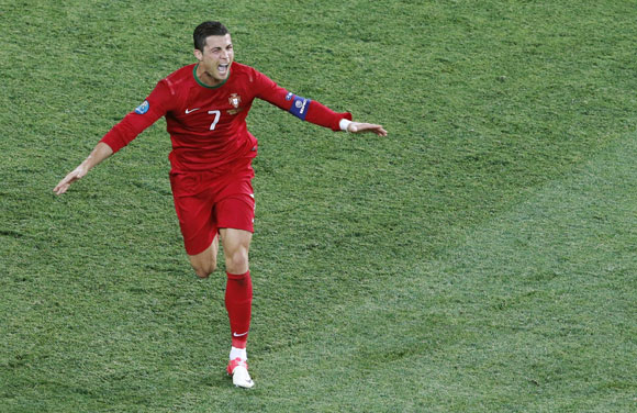 Portugal's Cristiano Ronaldo celebrates after scoring his second goal against Netherlands during their Group B match at the Metalist stadium in Kharkiv