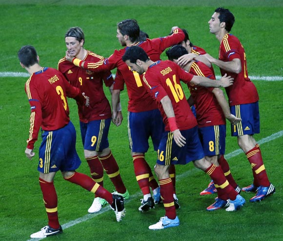 The Spanish players celebrate