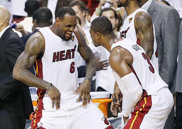 Miami Heat's LeBron James (left) and Dwyane Wade celebrate