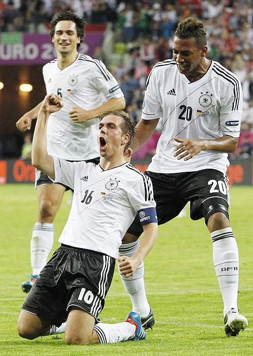 Germany's Philipp Lahm (centre) celebrates with team-mates Mats Hummels (left) and Jerome Boateng