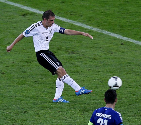 Philipp Lahm shoots to score the first goal for Germany