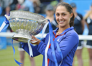 Tamira Paszek of Austria with the trophy after beating Angelique Kerber of Germany to win the Eastbourne tournament on Saturday
