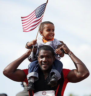 Justin Gatlin celebrates with his son Jace after winning the men's 100 meter final at the US Olympic athletics trials in Eugene, Oregon on Sunday