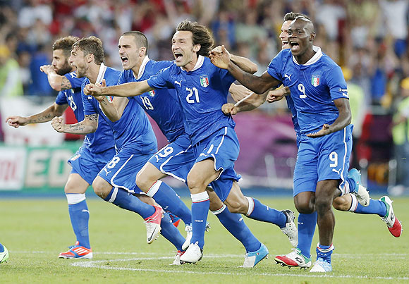 Italy's players celebrate after defeating England in penalty shoot-outs in the Euro quarter-final
