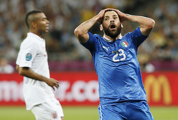 Italy's Antonio Nocerino (right) reacts after missing a scoring opportunity