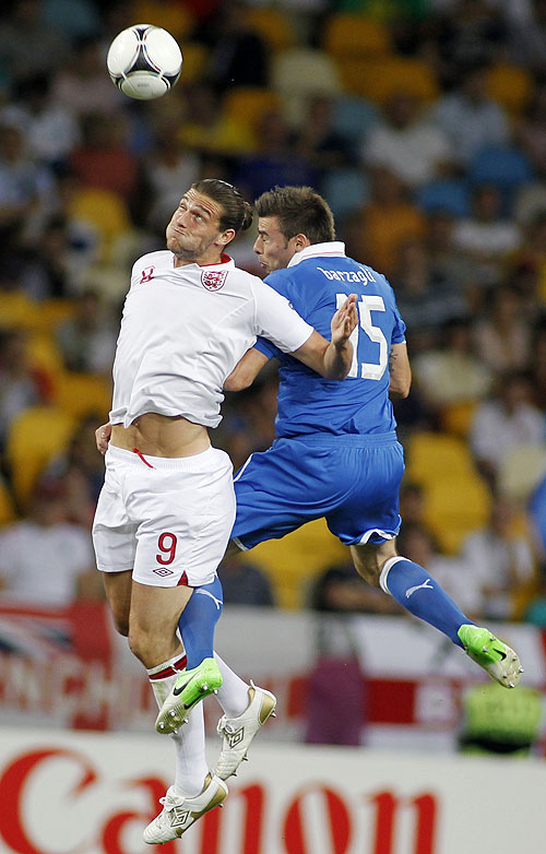 England's Andy Carroll (left) and Italy's Andrea Barzagli are involved in an aeriel battle for possession