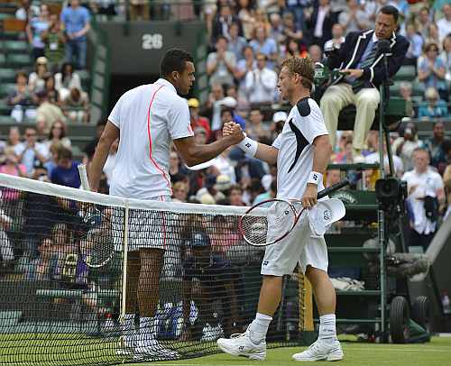 Jo-Wilfried Tsonga of France shakes hands with Lleyton Hewitt of Australia after defeating him in their men's singles tennis match at the Wimbledon tennis championships in London
