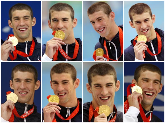 A combination photo shows Michael Phelps holding each of his eight gold medals he won at the Beijing 2008 Olympic Games