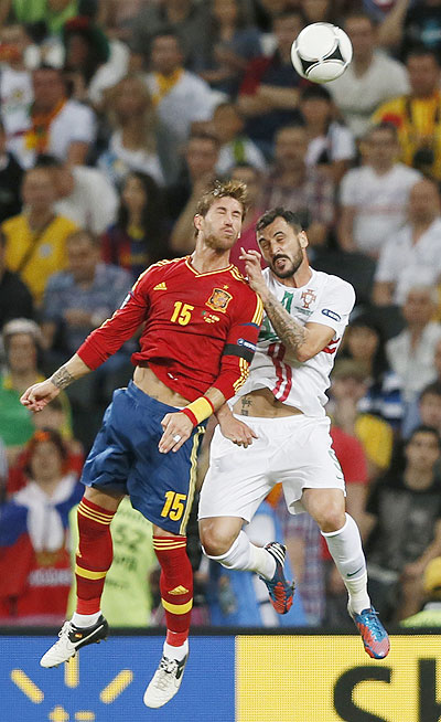 Spain's Sergio Ramos and Portugal's Hugo Almeida (right) in an aeriel challenge