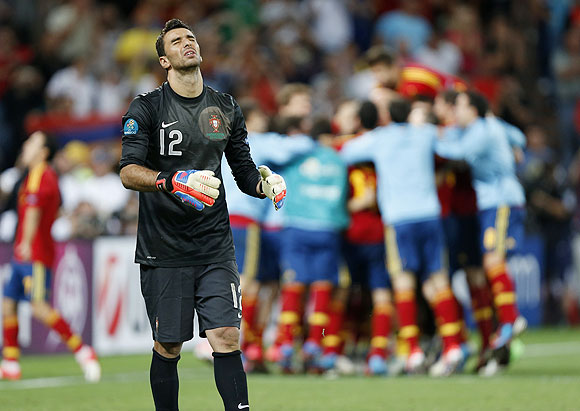 Portugal's goalkeeper Rui Patricio reacts as he failed to make a save at the last shot