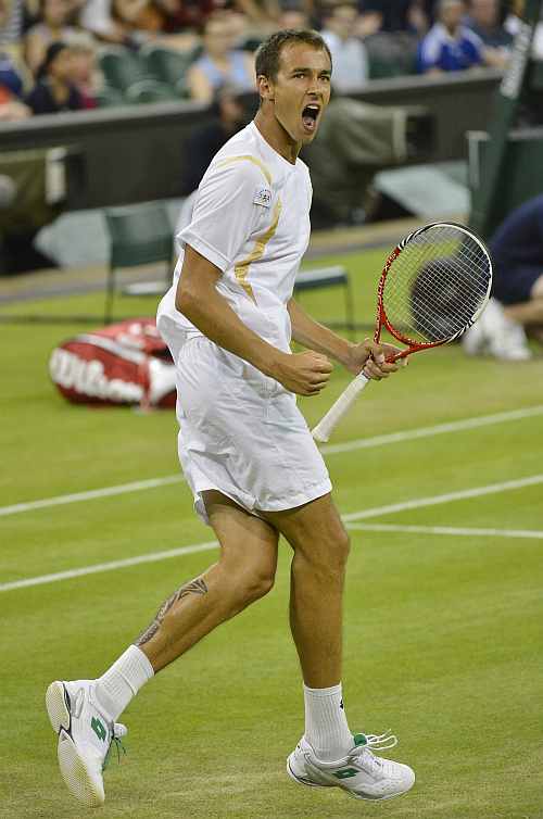 Lukas Rosol reacts to breaking the serve of Rafael Nadal in the fifth set during their men's singles match against at the Wimbledon