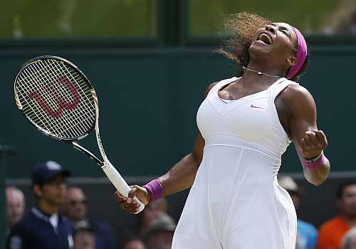 Serena Williams reacts after winning her match against Zheng Jie during their women's singles match at the Wimbledon