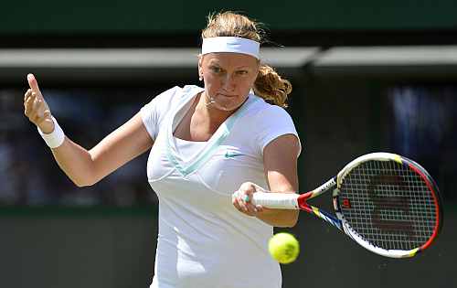 Petra Kvitova hits a return to Varvara Lepchenko during their women's singles match at the Wimbledon