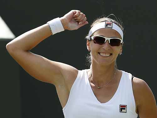Yaroslava Shvedova celebrates after defeating Sara Errani in their women's singles match at the Wimbledon