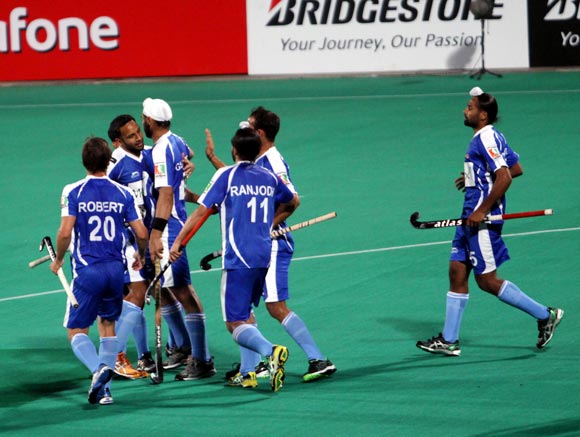 Chandigarh Comets players celebrate after scoring a goal