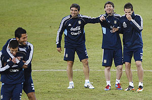 Argentina's Lionel Messi (2nd from right) attends a training session with teammates Rodrigo Brana (3rd from right) and Fernando Gago (right)