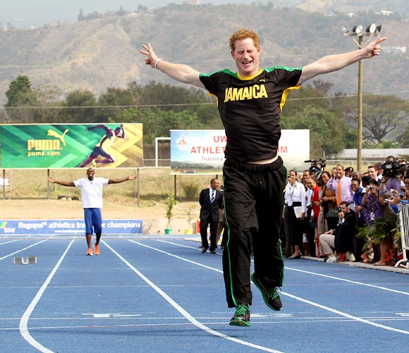 Prince Harry leaves Usain Bolt in his wake as he races him at the Usain Bolt Track at the University of the West Indies in Kingston