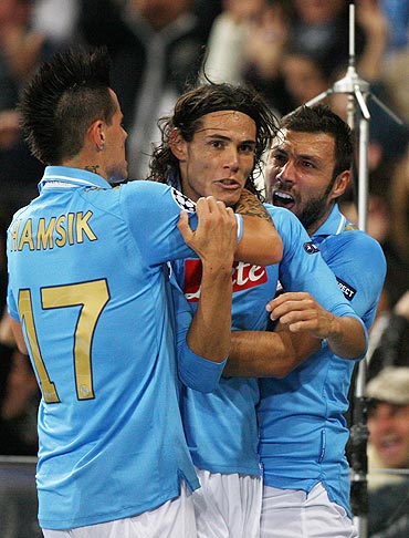 Edinson Cavani (centre) of Napoli celebrates with his team-mates