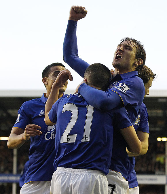 Everton's Nikica Jelavic (2nd from) celebrates after scoring against Tottenham Hotspur on Saturday