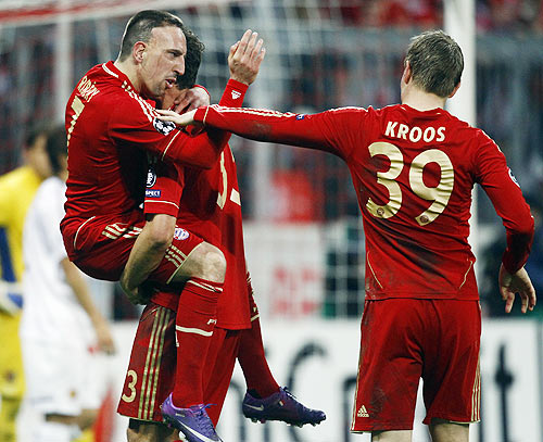 Bayern Munich's Franck Ribery, Mario Gomez and Toni Kroos celebrate their fifth goal against FC Basel during their Champions League round-of-16 second leg match in Munich
