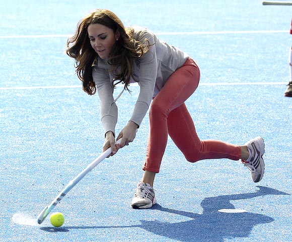 Catherine, Duchess of Cambridge, plays hockey with the Great Britain hockey teams at the Riverside Arena in the Olympic Park in London