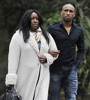 Tottenham Hotspurs' footballer Jermain Defoe (right) arrives with his mother Sandra St Helen at the London Chest Hospital in London to visit Fabrice Muamba on Sunday