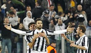 Juventus' Mirko Vucinic (centre) celebrates with teammates after scoring against AC Milan during their Italian Cup semi-final in Turin on Tuesday