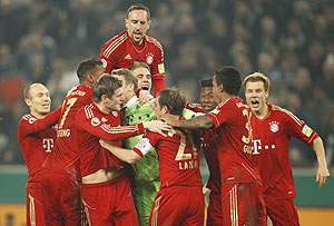 Manuel Neuer, goalkeeper of Bayern Munich celebrates with his team mates after saving the decisive penalty of their German Cup semi-final against Borussia Moenchengladbach in Moenchengladbach on Wednesday