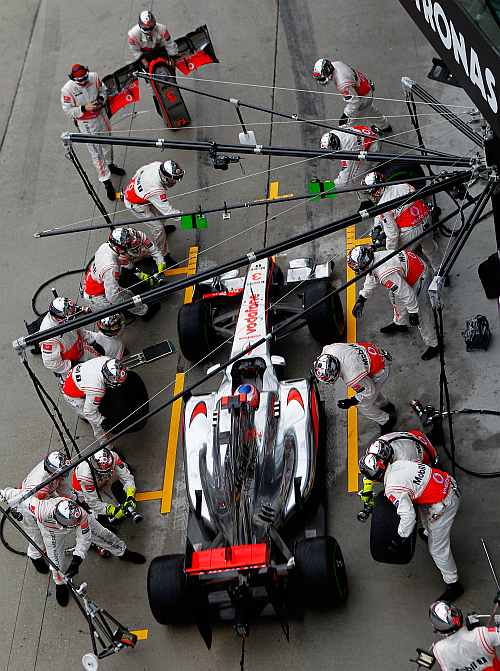 McLaren's Jenson Button stops for a pitstop during the Malaysian Formula One Grand Prix at the Sepang Circuit