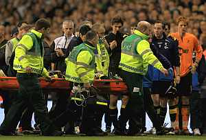 Fabrice Muamba of Bolton Wanderers is taken off on a stretcher, after receiving CPR treatment on the pitch after suddenly collapsing during the FA Cup Sixth Round match vs Tottenham Hotspur