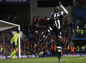 Newcastle United's Papiss Cisse celebrates after scoring against Chelsea during their Premiership match at Stamford Bridge on Wednesday