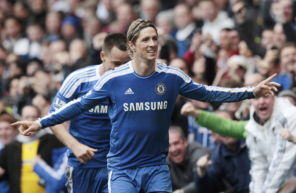 Chelsea's Fernando Torres celebrates his 3rd goal against Queens Park Rangers during their English Premier League soccer match at Stamford Bridge in London