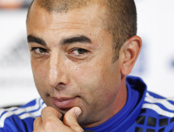 Chelsea's caretaker manager Roberto Di Matteo listens to a question during a news conference at the team's training facility in Stoke D'Abernon, south of London