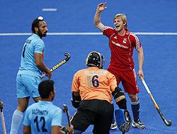 Britain's Ashley Jackson (right) celebrates his first goal against India during the men's International Invitational Hockey Tournament at the Riverbank Arena on the Olympic Park in London on Thursday