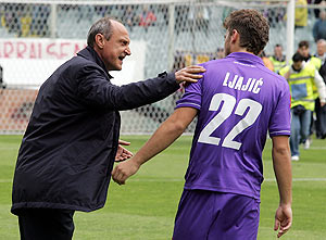 Fiorentina head coach Delio Rossi shouts instructions to his player Adem Ljajic