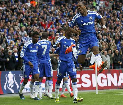 Chelsea's Didier Drogba celebrates scoring his team's second goal against Liverpool's during their FA Cup final