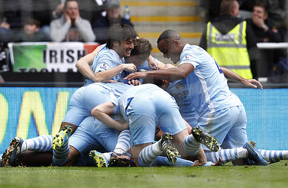 Manchester City players celebrate with Yaya Toure after he scoring against Newcastle United during their EPL match in Newcastle on Sunday