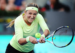 Belarus's Victoria Azarenka plays a double handed backhand against Serbia's Ana Ivanovic during the Madrid Open on Wednesday