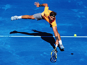 Rafael Nadal of Spain plays a backhand during his 3rd round match against Nikolay Davydenko of Russia