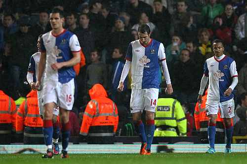 Radosav Petrovic of Blackburn Rovers and his team mates look dejected after conceding a goal during the Barclays Premier League match
