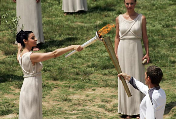 High Priestess Ino Menegaki lights the London 2012 Olympic Torch during the Lighting Ceremony of the Olympic Flame at Ancient Olympia on May 10, 2012 in Olympia, Greece