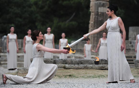 High Priestess Ino Menegaki lights the Olympic flame at the Temple of Hera during the Lighting Ceremony of the Olympic Flame at Ancient Olympia on May 10, 2012 in Olympia, Greece