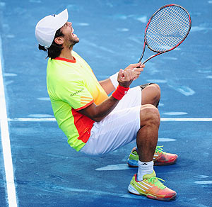 Spain'S Fernando Verdasco collapses in celebration after defeating compatriot Rafael Nadal during their 4th round tie of the Madrid Masters
