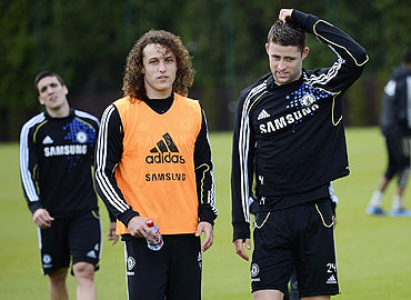 Chelsea's David Luiz (left) and teammate Gary Cahill at a team practice session