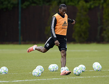 Chelsea's Didier Drogba shoots at goal during a team practice session
