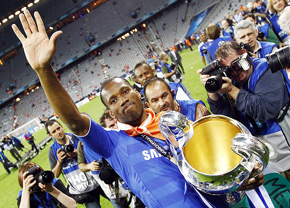 Chelsea's Didier Drogba celebrates with the trophy
