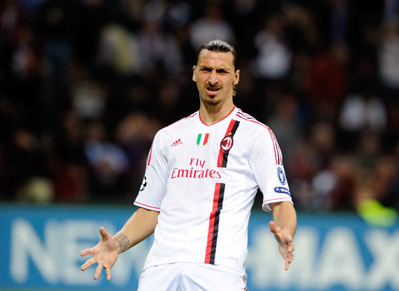Zlatan Ibrahimovic of AC Milan reacts during the UEFA Champions League quarter final first leg match between AC Milan and Barcelona at Stadio Giuseppe Meazza on March 28, 2012 in Milan