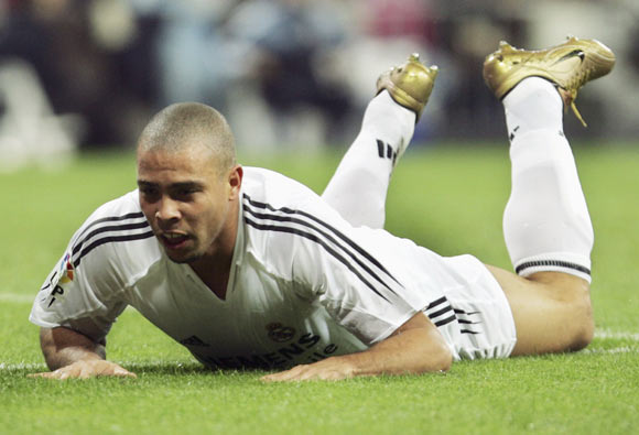 Real Madrid's Ronaldo slides on the ground after missing a shot during a La Liga match at The Bernabeu, on October 31, 2004 in Madrid