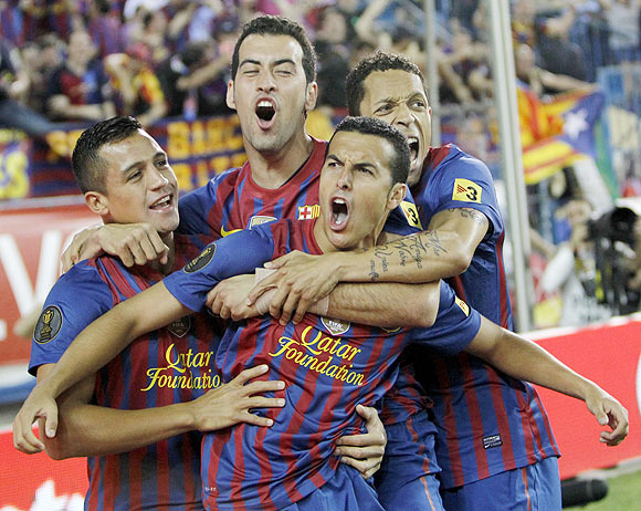 Barcelona's Pedro Rodriguez celebrates with teammates Alexis Sanchez , Sergio Busquets and Adriano after scoring the winner against Athletic Bilbao during their Spanish King's Cup final