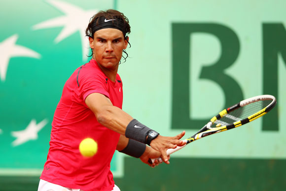 Rafael Nadal of Spain plays a forehand during his men's singles second round match against Denis Istomin of Uzbekistan